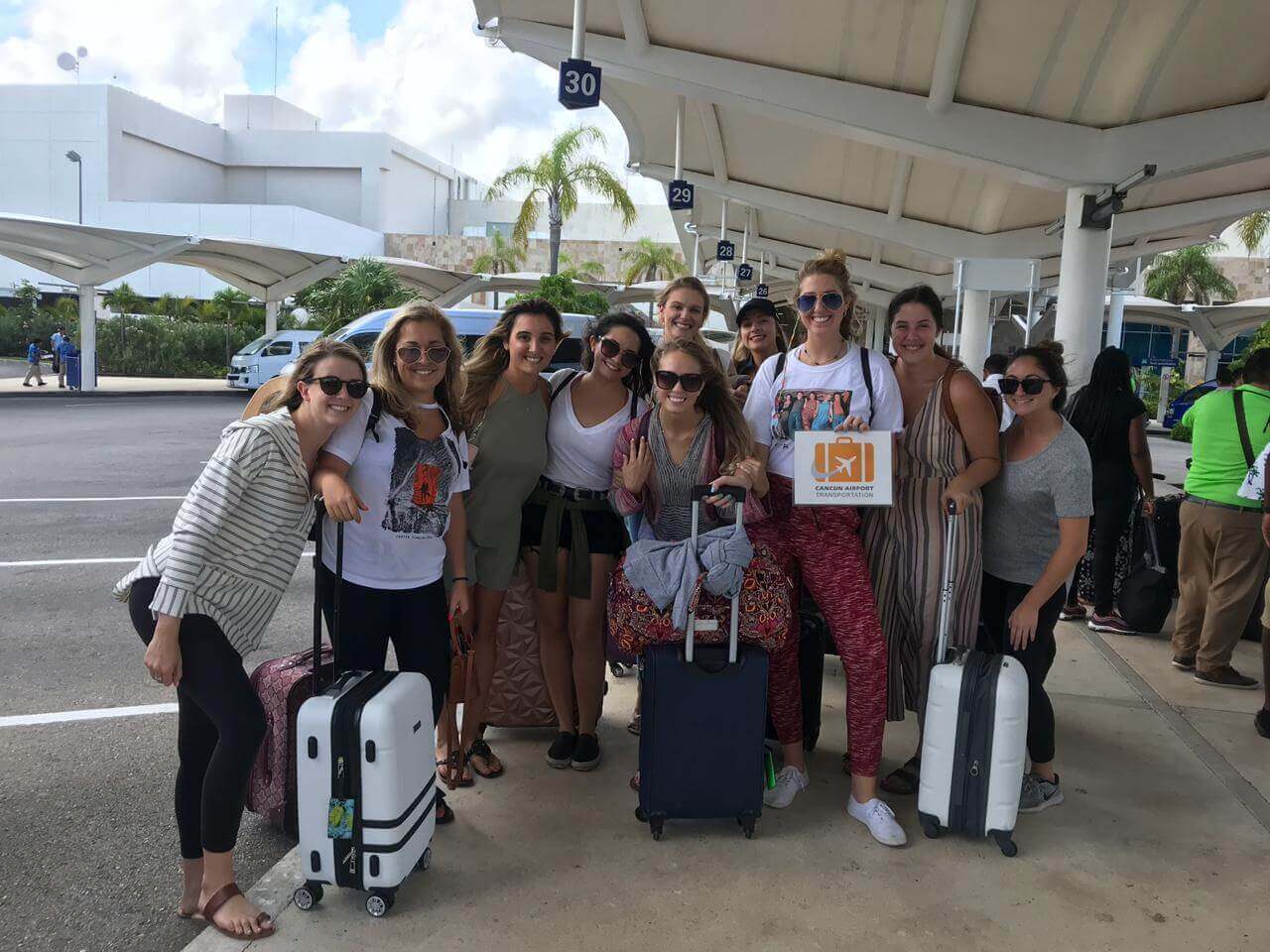 Group of girls arriving to the airport